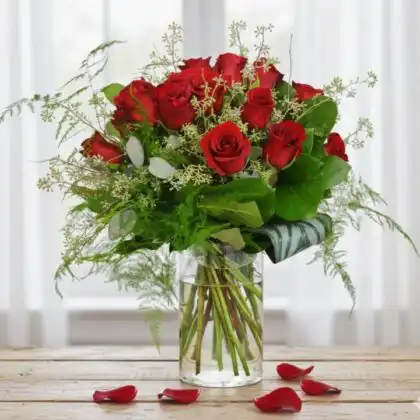 A vibrant love red rose bouquet wrapped in premium dark packaging, perfect for romantic gestures and anniversaries.