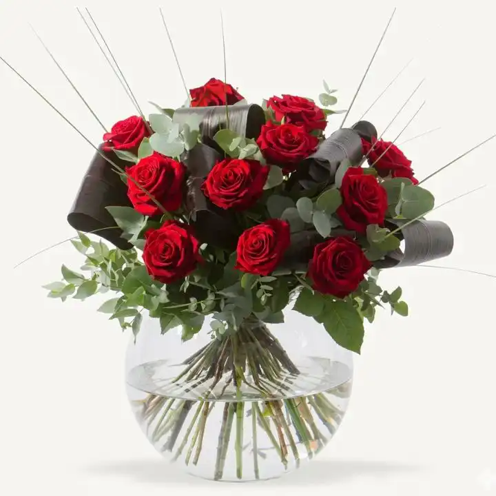 Luxury Red Roses in Vase 1 Stunning arrangement of luxury red roses fresh flowers placed in a stylish transparent vase.