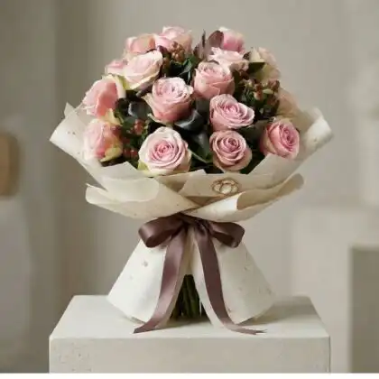 Hand-tied pink rose bridal bouquet featuring dusty pink roses and hypericum berries with green salal leaves.