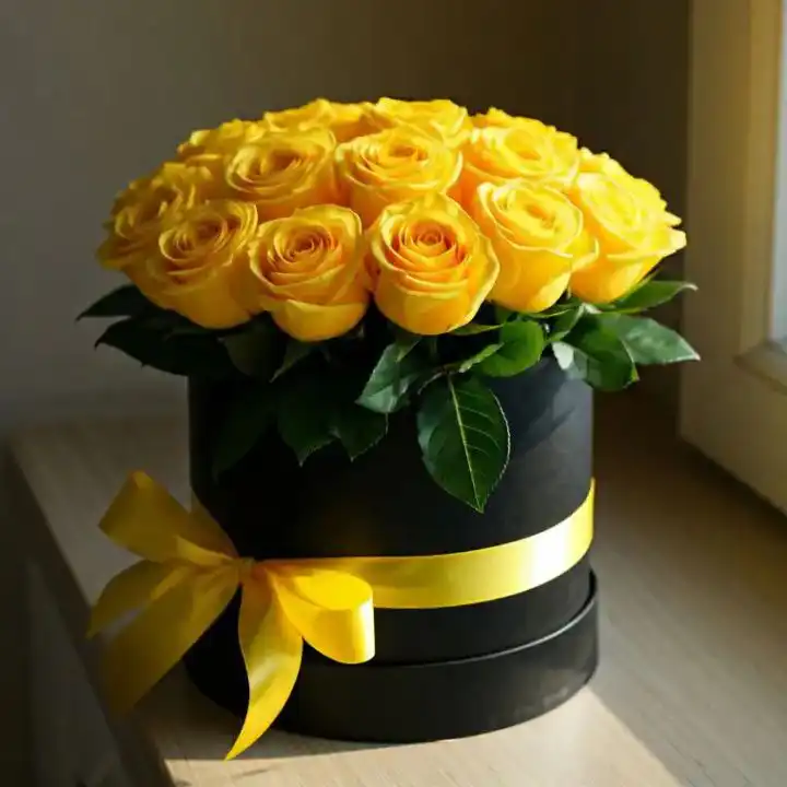 Luxury Yellow Roses Hatbox 1 A luxury arrangement of fresh yellow roses in box with a golden ribbon for a premium gift presentation.