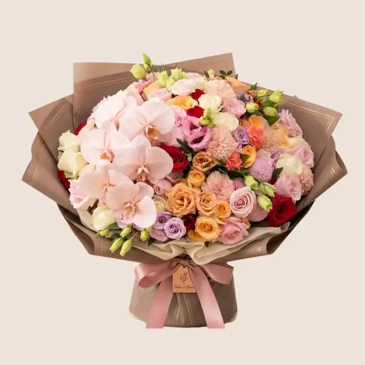 Mixed Orchid & Rose Dream Bouquet 1 Handcrafted orchid and rose bouquet featuring vibrant blooms and lush greenery in a professional studio setting.
