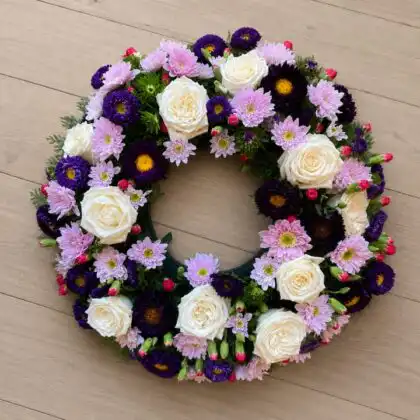 Serene White Rose & Purple Aster Funeral Wreath with Spray Chrysanthemum , Pink Lisianthus Buds , Red Hypericum Berries