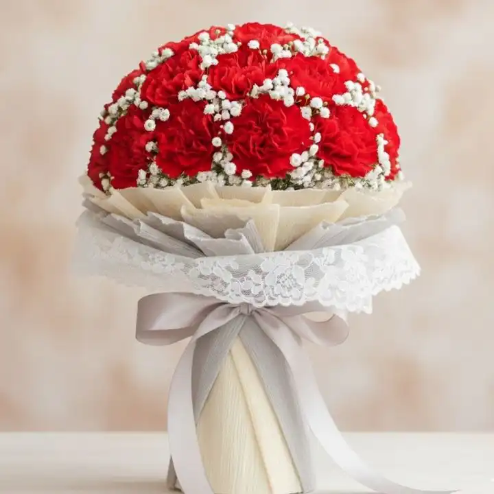 Radiant Scarlet Carnation & Graceful Gypsophila Bouquet 1 A stunning red carnation bridal bouquet paired with delicate white gypsophila and green foliage for a wedding ceremony.