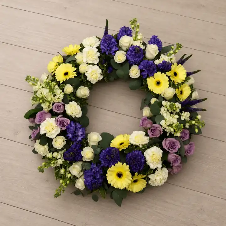 White Rose and Yellow Gerbera Funeral Wreath with Purple Hyacinth 1 White Rose and Yellow Gerbera Funeral Wreath with Purple Hyacinth ,White Carnation , Purple Veronica .