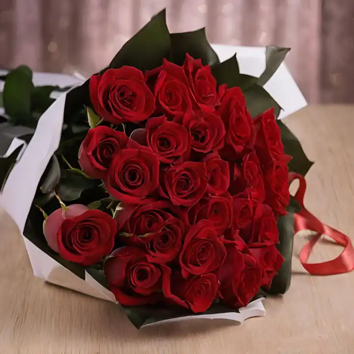 25 Flower Bouquet 1 A hand-tied 25 flower bouquet of fresh red roses wrapped in premium white and black paper with a silk ribbon.