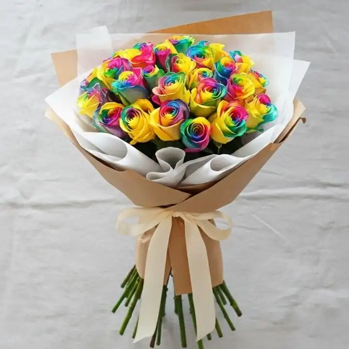 Vibrant Radiance Hand-Tied Rainbow Roses 1 A stunning rainbow rose bouquet with vibrant multicolored petals arranged in a professional hand-tied wrap.