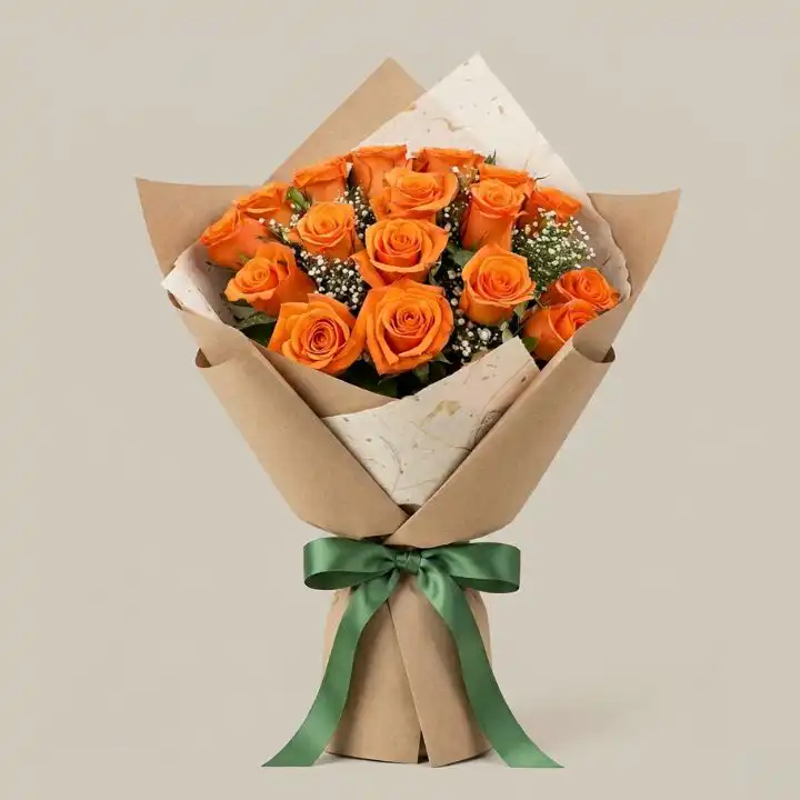 Modern Orange Roses Bouquet 1 Hand-tied orange rose bridal bouquet with fresh green leaves arranged for a vibrant wedding theme.