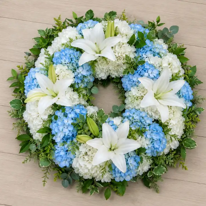 Serene Blue & White Hydrangea Memorial Wreath With Lilies 1 Serene Blue & White Lilies & Hydrangea Memorial Wreath with greenery