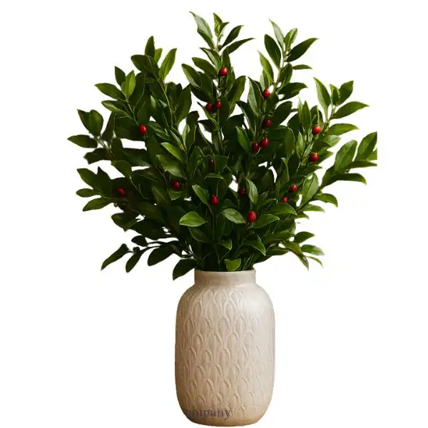 Fresh Green Christmas Foliage Arrangement 1 A beautiful Fresh Green Christmas Foliage Arrangement in a textured cream vase with bright red berries.