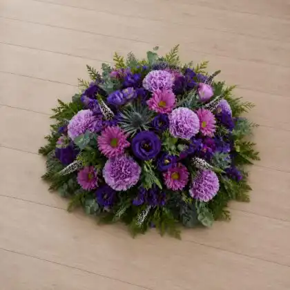 Vibrant Purple and Thistle Posy of Flowers for a Funeral